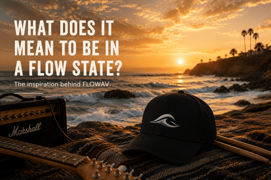 Coastal sunset with ocean waves, a guitar, and FLOWAV hat for the What Does It Mean to Be in a Flow State article.