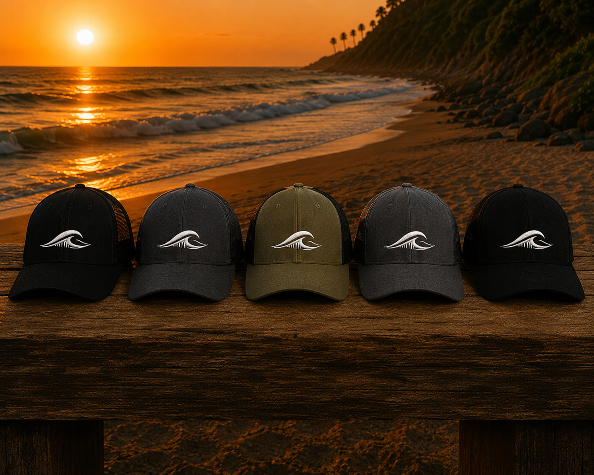 FLOWAV coastal hats with embroidered wave logo on the beach at sunset