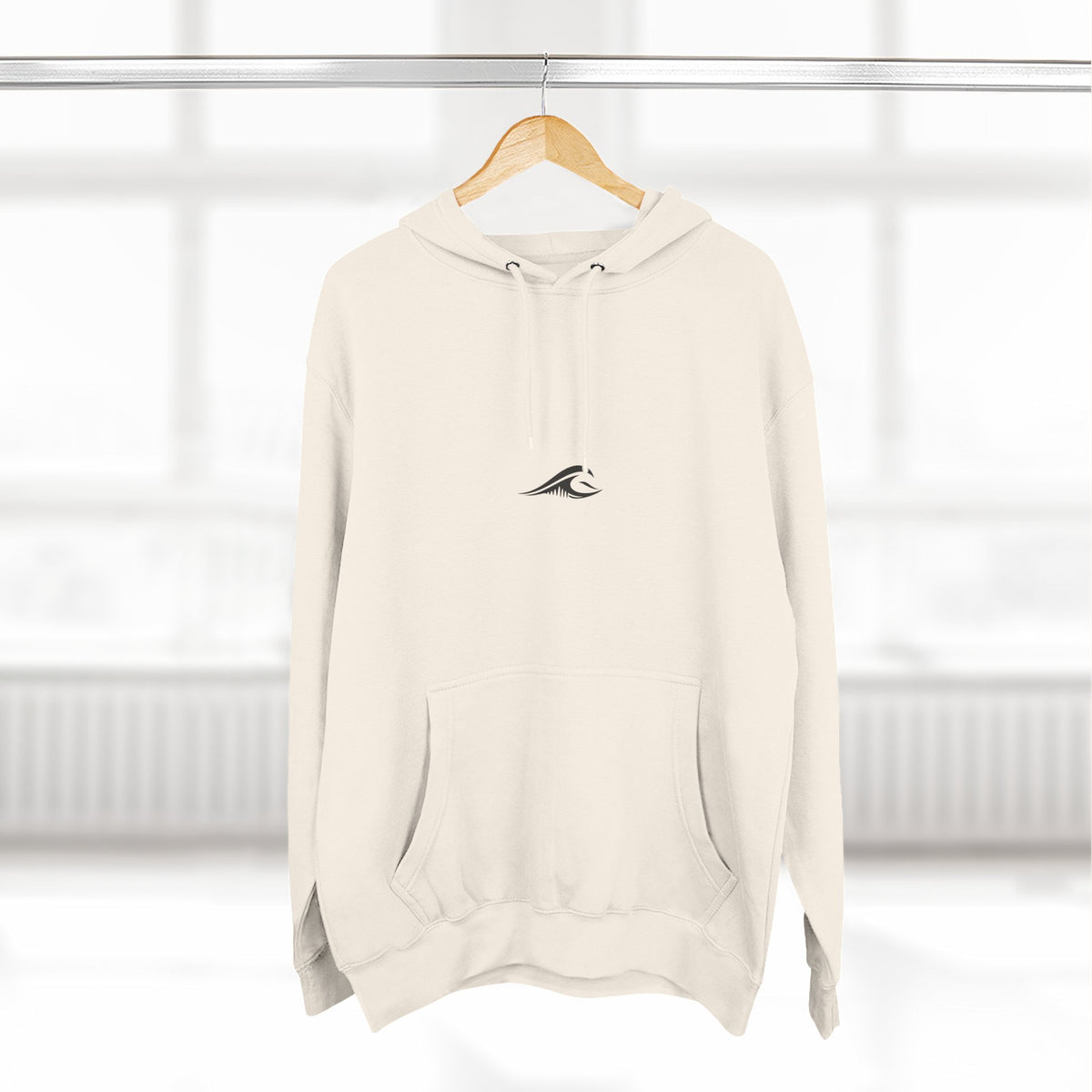 FLOWAV Signature Wave Hoodie in sandshell hanging on a hanger showing the front wave logo