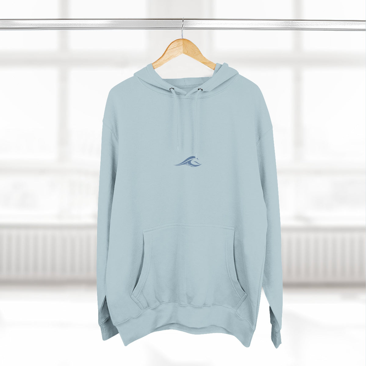 FLOWAV Signature Wave Hoodie in blue mist hanging on a hanger showing the front wave logo