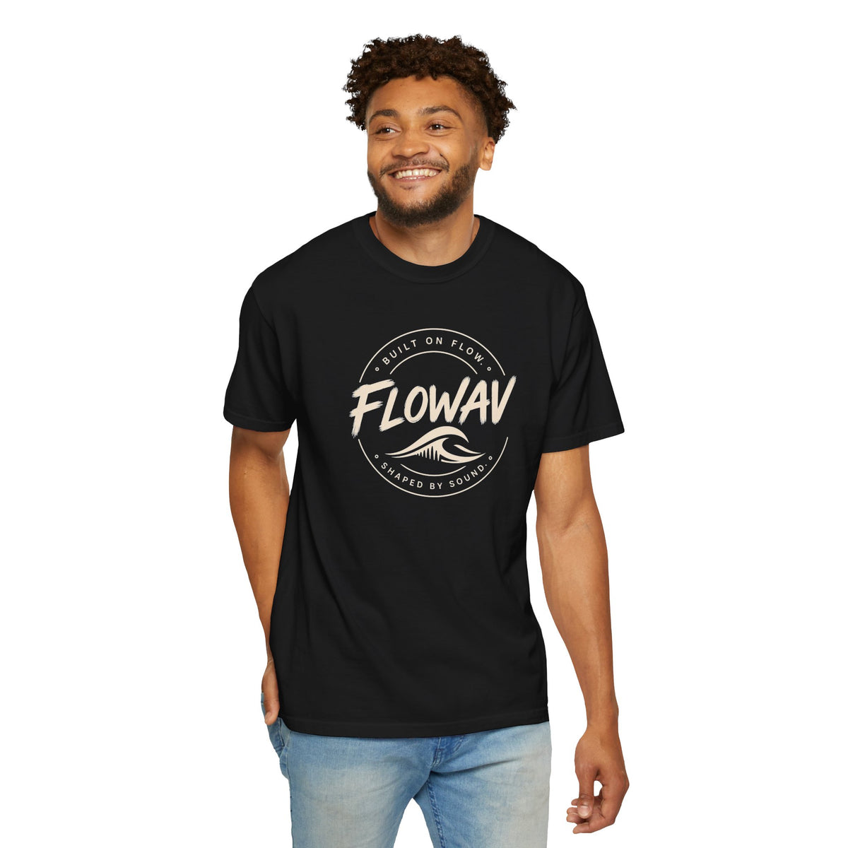 Man wearing FLOWAV Coastal Badge Tee in black - front view showing surf and music inspired graphic