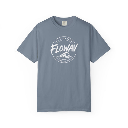 FLOWAV Coastal Badge Tee in blue jean laid flat showing the front badge graphic.