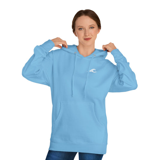A woman wearing a FLOWAV Coastal Graphic pullover hoodie in blue aqua showing the front white flowav logo on the chest