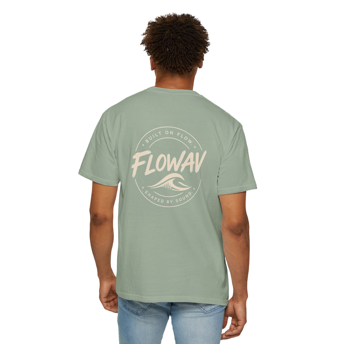 Man wearing FLOWAV Coastal Graphic Tee in Bay - back view showing surf and music inspired graphic