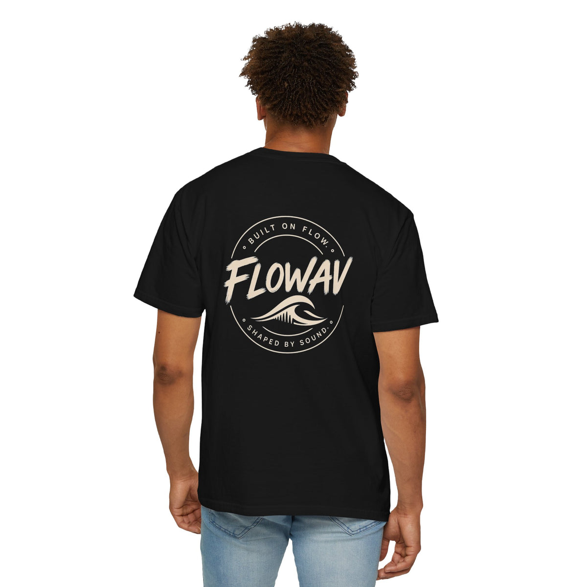 Man wearing FLOWAV Coastal Graphic Tee in Black - back view showing surf and music inspired graphic