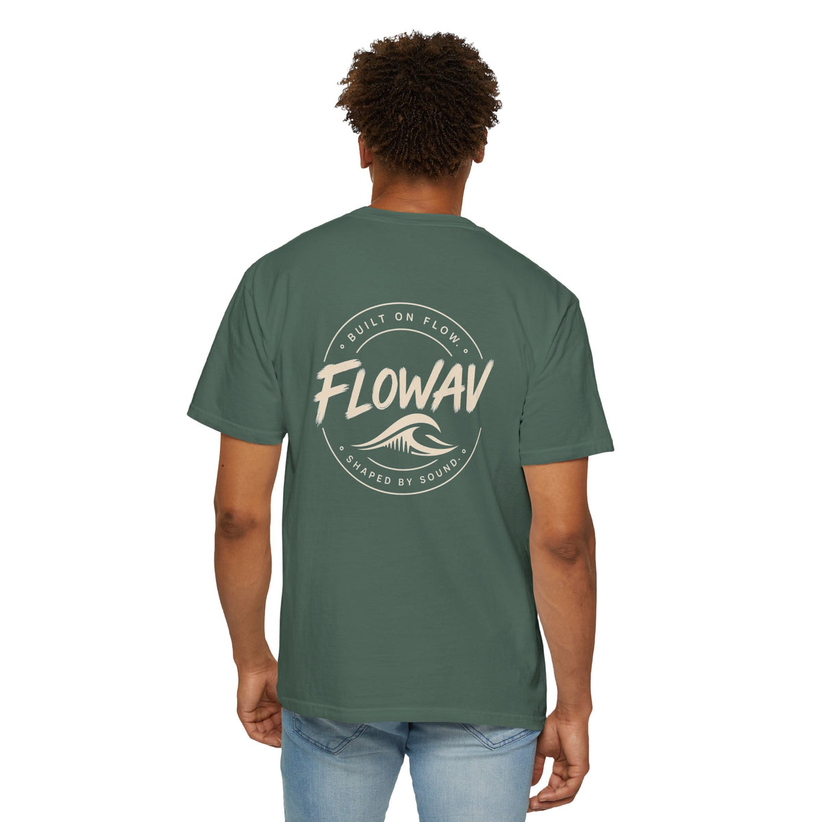 Man wearing FLOWAV Coastal Graphic Tee in Blue Spruce - back view showing surf and music inspired graphic