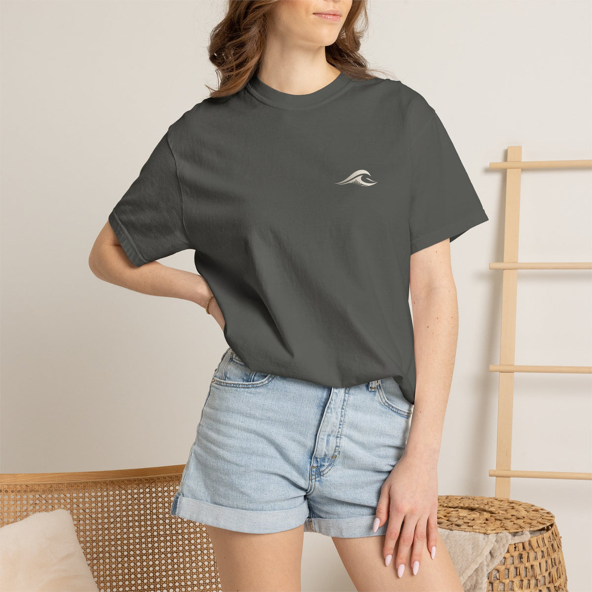 Woman wearing FLOWAV Coastal Graphic Tee in Pepper - front view with wave chest logo