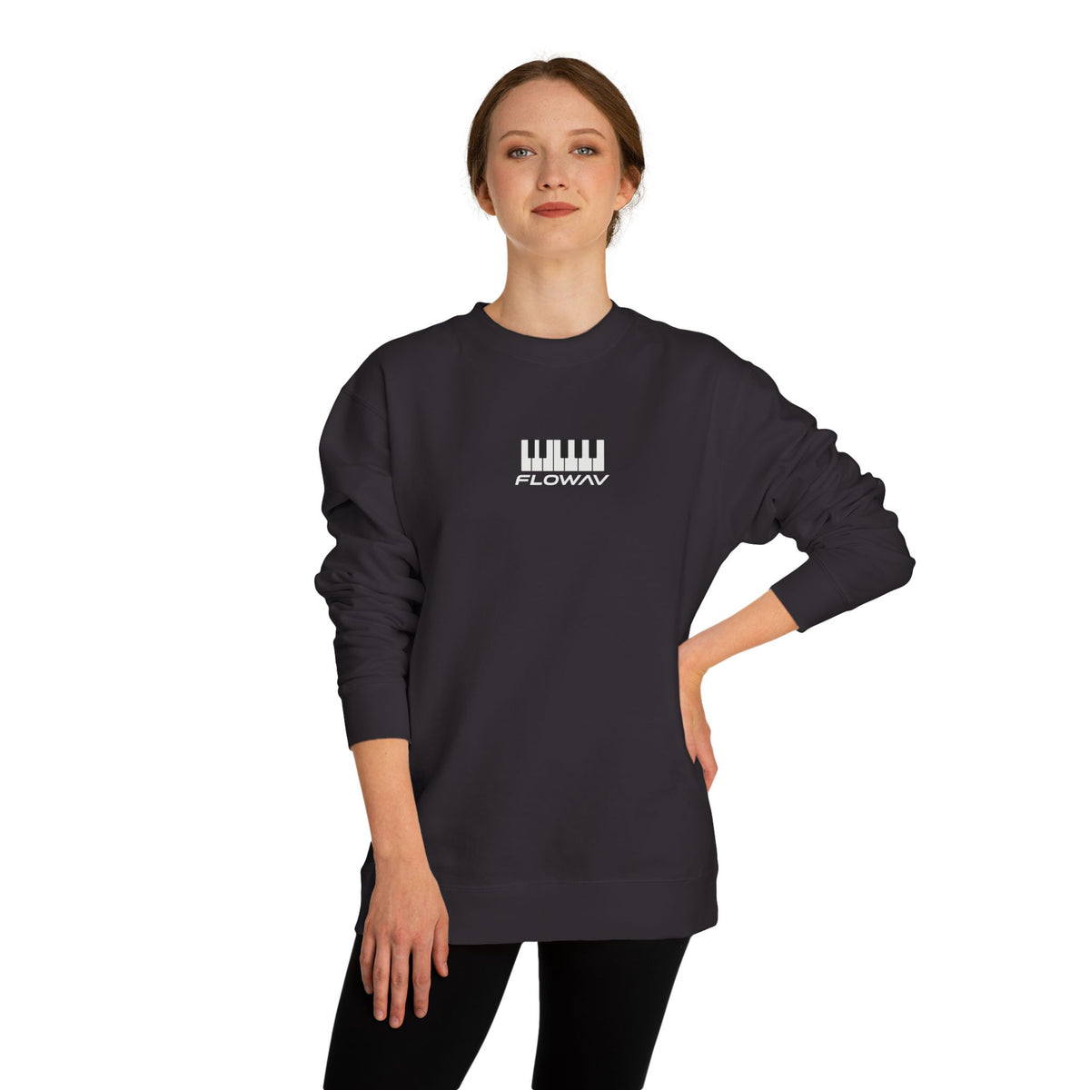 Woman wearing the FLOWAV Keys Crewneck Sweatshirt in black showing the piano keys and wordmark on the center chest