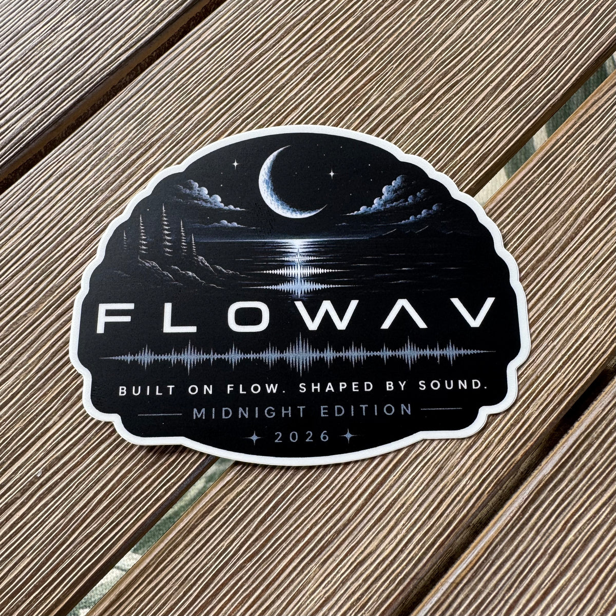 FLOWAV Midnight Edition vinyl sticker featuring a moon and clouds over water with trees and rocks and a soundwave graphic. Built on Flow. Shaped by Sound.