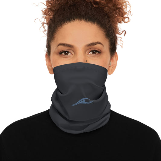 Woman wearing the FLOWAV Winter Neck Gaiter in charoal showing the front dusty blue wave logo