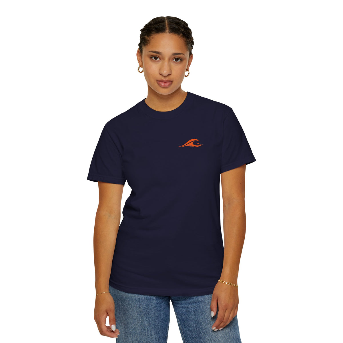 A woman wearing the FLOWAV Ride the Freakuency Graphic Tee in True Navy showing the front orange wave logo.